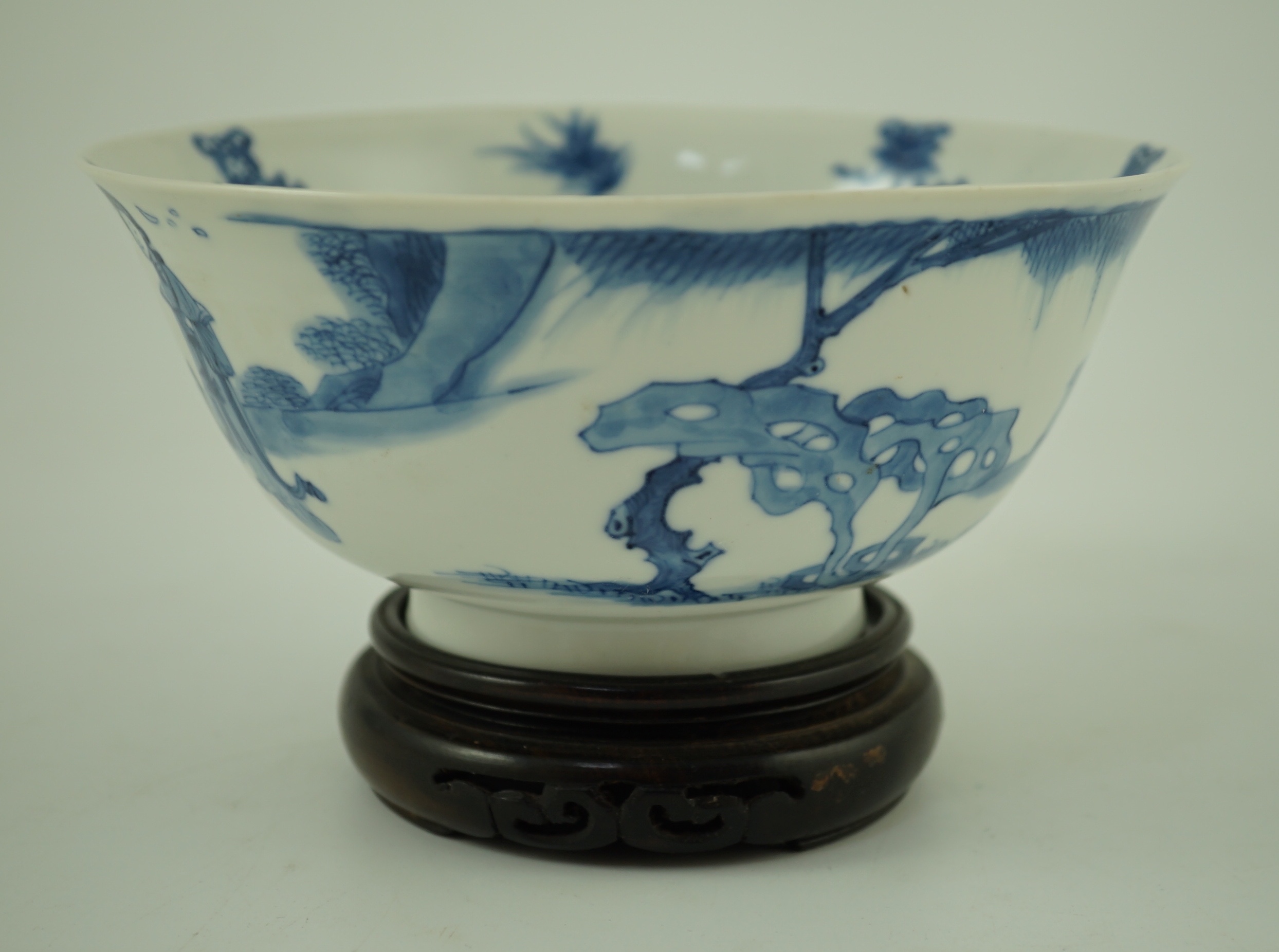 A Chinese blue and white ‘ladies’ bowl, Kangxi period, 15.5cm diameter, wood stand